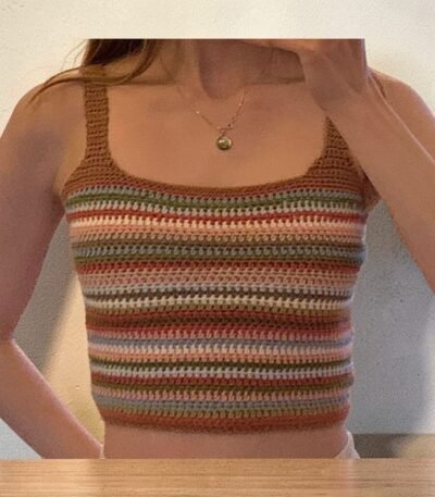 Woman wearing handmade multicolor crochet striped crop tank top with spaghetti straps