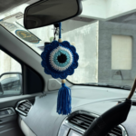 blue crochet evil eye car hanging with tassel hanging inside car
