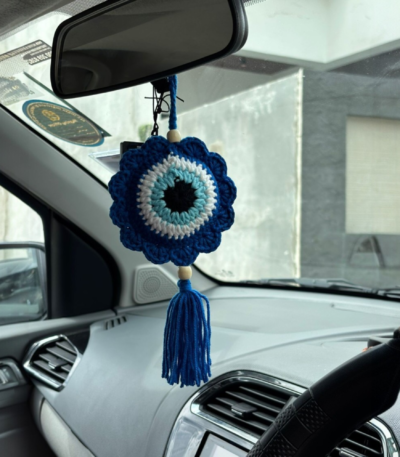 blue crochet evil eye car hanging with tassel hanging inside car