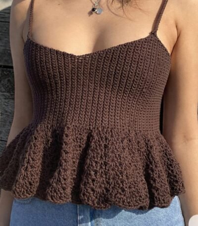 Woman wearing handmade brown crochet camisole top with flared hem