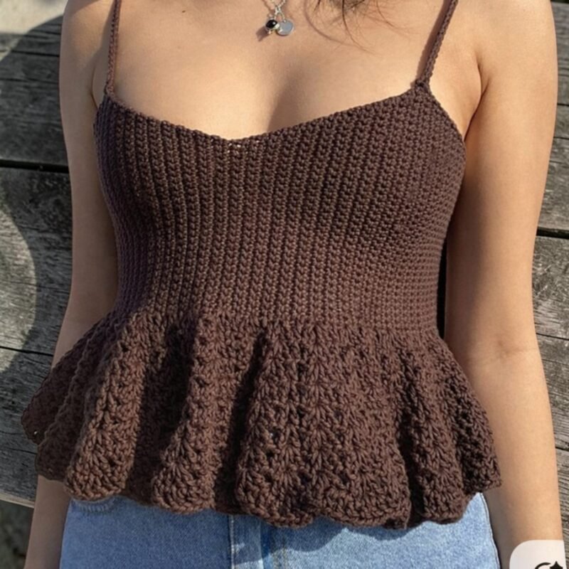 Woman wearing handmade brown crochet camisole top with flared hem